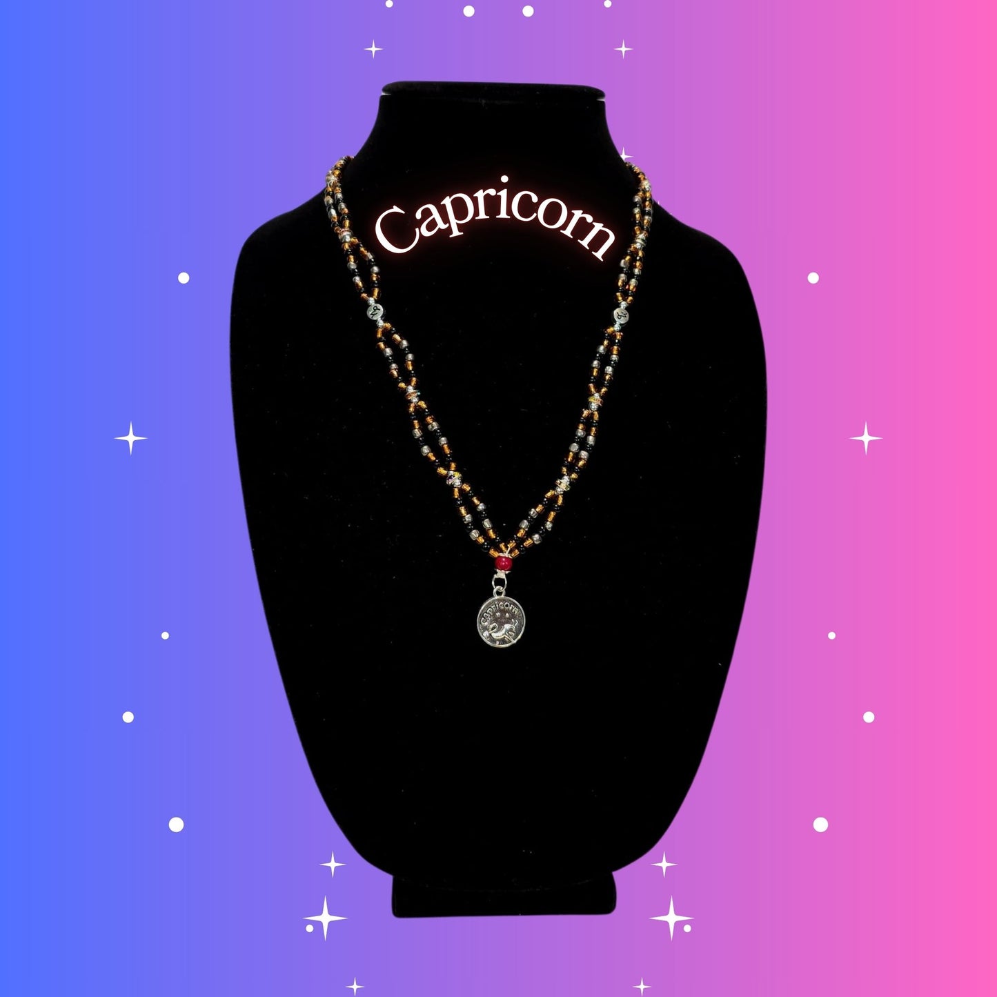 Capricorn Zodiac Necklace – handmade brown and black beaded necklace with silver-tone Capricorn pendant, crafted by Gitana Mystical Products.