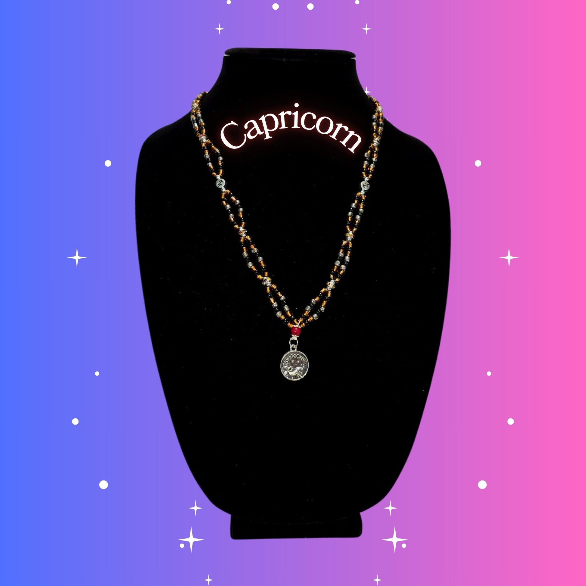 Capricorn Zodiac Necklace – handmade brown and black beaded necklace with silver-tone Capricorn pendant, crafted by Gitana Mystical Products.